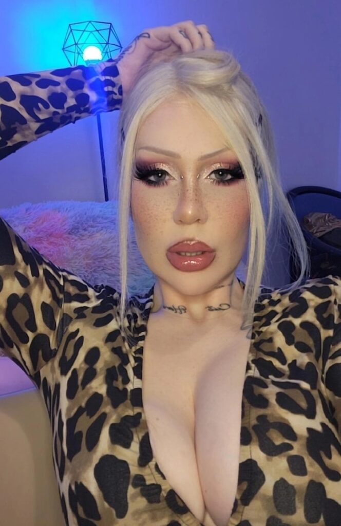 Goddess Isabel leopard catsuit on couch